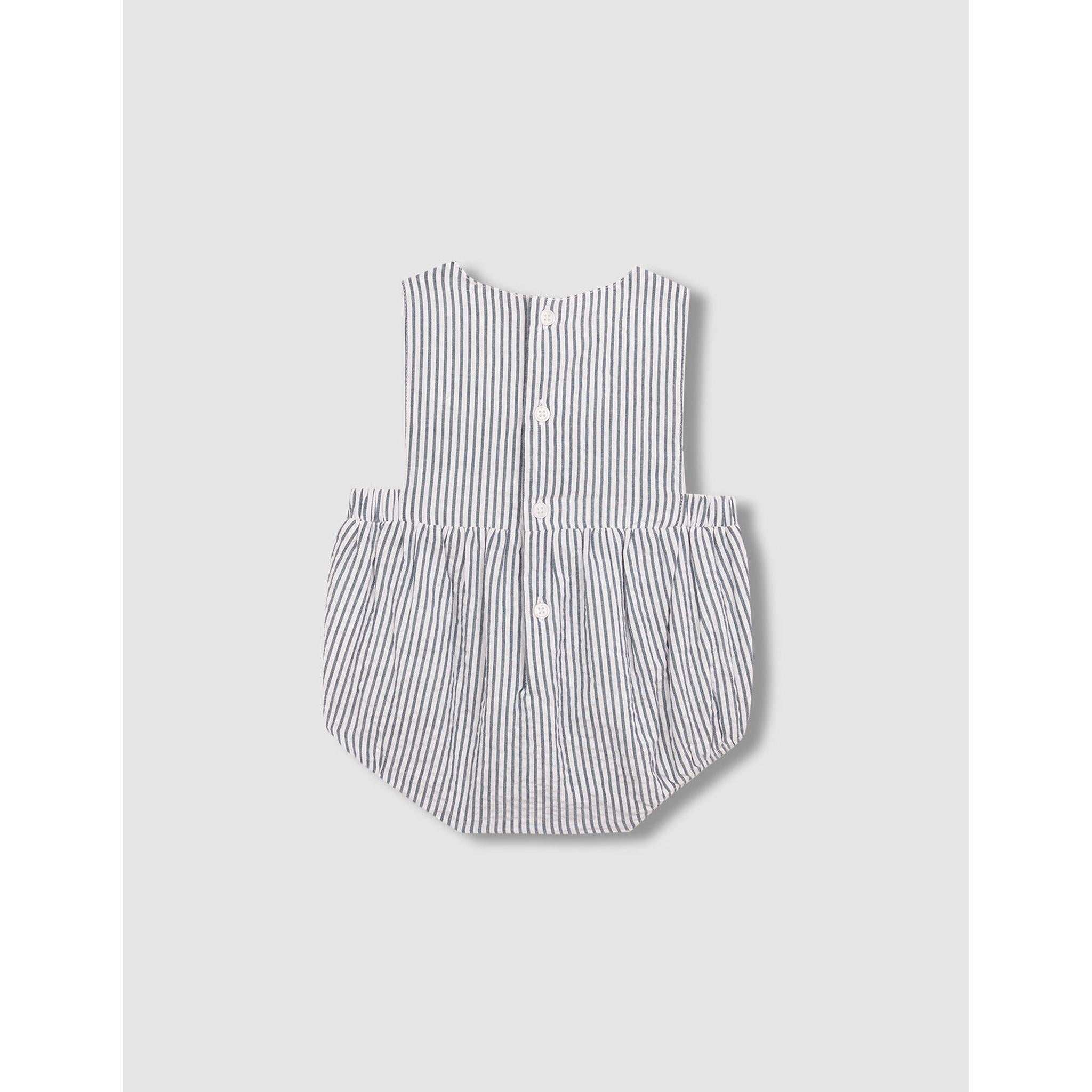 Ranita de rayas con smock azul claro